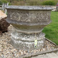 Lot 1012 - A reconstituted stone octagonal garden font