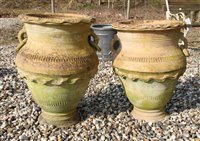 Lot 1077 - A pair of terracotta twin handled olive jars