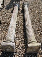 Lot 1104 - A pair of reconstituted stone classical design pillars