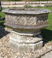 Lot 1008 - A reconstituted stone octagonal font