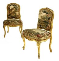 Lot 546 - A pair of Louis XV style transitional giltwood side chairs, c.1870, with carved foliate frames and Aubusson tapestry upholstery (2)