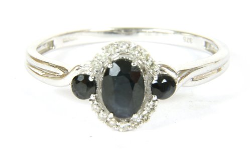 Lot 36 - A white gold sapphire and diamond  cluster ring