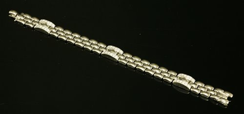 Lot 436 - An 18ct white gold diamond set panther style bracelet