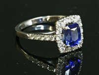 Lot 501 - An 18ct white gold sapphire and diamond cluster ring