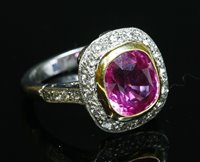Lot 209 - An 18ct gold pink sapphire and diamond cluster ring
