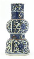 Lot 33 - A Chinese wucai gu vase