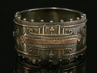 Lot 119 - A late Victorian silver flat section hinged bangle