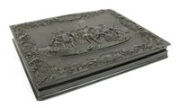 Lot 224 - A 19th century ebony dual casket cover depicting triumph over the enemy