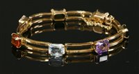 Lot 214 - A two row gold gemstone bracelet
