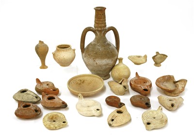 Lot 201 - A collection of Roman terracotta oil lamps and other ancient pottery items
