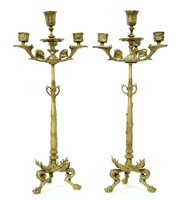 Lot 422 - A pair of gilt brass four light candelabra