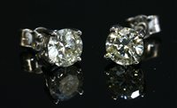 Lot 481 - A pair of 18ct white gold single stone diamond stud earrings