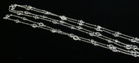 Lot 571 - A white gold diamond set long chain