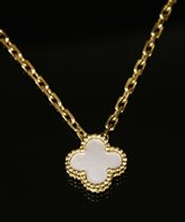 Lot 408 - A gold mother of pearl pendant