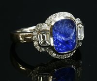 Lot 292 - An 18ct white gold sapphire and diamond cluster ring