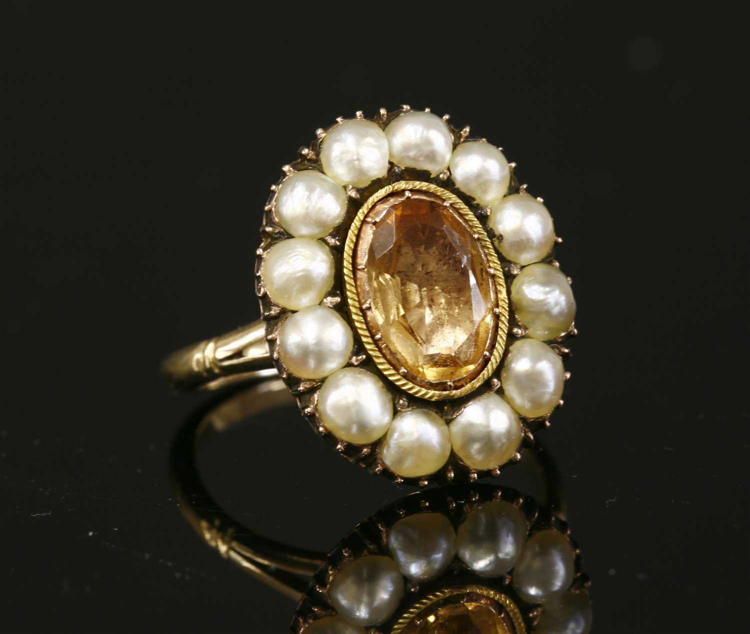Lot 16 - A Georgian foiled topaz and split pearl cluster