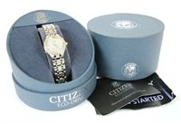 Lot 285 - A ladies bi-colour diamond set Citizen Eco-Drive Quartz bracelet watch