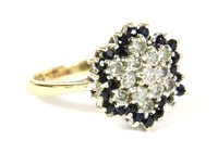 Lot 202 - A 9ct gold diamond and sapphire cluster ring