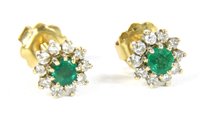Lot 67 - A pair of gold emerald and diamond cluster earrings