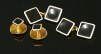 Lot 660 - A pair of Art Deco gold and platinum onyx cufflinks