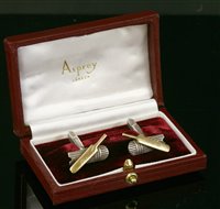 Lot 662 - A cased pair of sterling silver and 9ct gold cricket bat and pad cufflinks