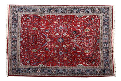 Lot 672 - A red ground woollen Kadjar carpet