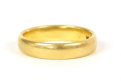 Lot 44 - A 22ct gold court shaped wedding rings