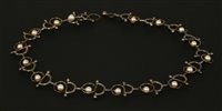 Lot 265 - A cased sterling silver, 18ct gold and cultured pearl necklace, by Brett Payne