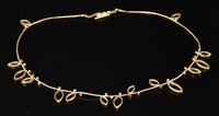 Lot 393 - A gold diamond and pierced leaf link necklace, by Louise O'Neill