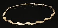 Lot 389 - A 9ct gold articulated plaque link necklace