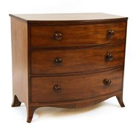 Lot 688 - A mahogany bow front chest