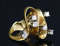 Lot 397 - A gold diamond set wave head ring, c.1970