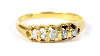 Lot 234 - A gold five stone graduated diamond ring