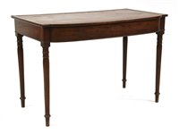 Lot 681 - A George III leather inset mahogany writing table