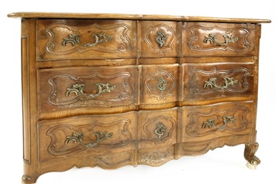 Lot 762 - A French walnut serpentine front commode