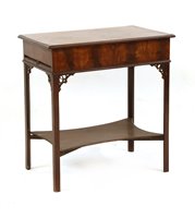 Lot 655 - A George III mahogany dressing table, the moulded rectangular top openng to reveal a fitted interior, the top section with pull out slides