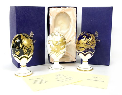 Lot 350 - Three Royal Worcester gold Faberge eggs