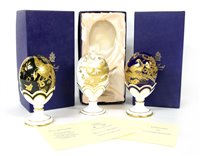 Lot 350 - Three Royal Worcester gold Faberge eggs