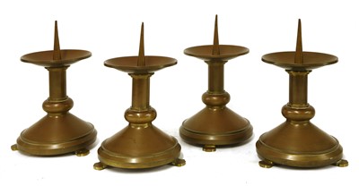 Lot 278 - A set of four brass pricket candlesticks