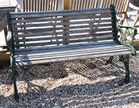 Lot 1073 - A pair of green painted metal and teak garden benches