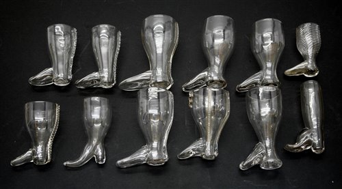 Lot 263 - A collection of twelve glass boot form stirrup cups