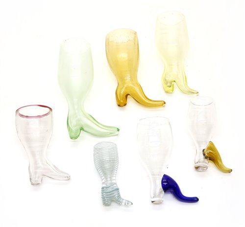Lot 219 - A collection of glass boot form stirrup cups,...