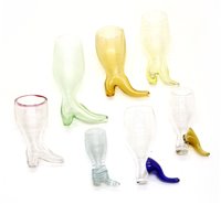 Lot 219 - A collection of glass boot form stirrup cups,...