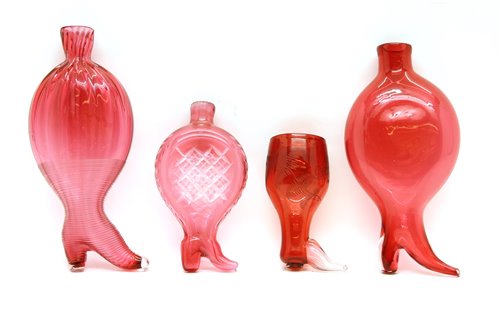 Lot 314 - A cranberry glass boot form gimmel flask