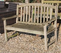 Lot 1102 - Two teak slatted garden benches