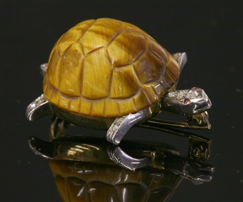 Lot 226 - A gold and silver tiger's eye, diamond and ruby tortoise brooch