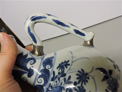 Lot 458 - A Chinese blue and white ewer
