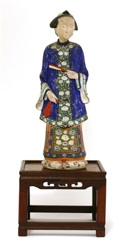 Lot 90 - A Chinese painted clay nodding-head figure