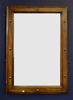 Lot 542 - A modern wooden framed mirror, decorated with...