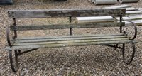 Lot 1125 - A wrought iron and slatted garden bench, 183...